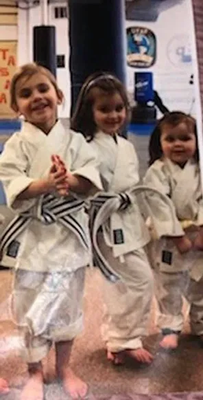Young students in uniform on the mat